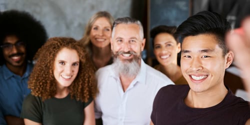 customer-led-growth - a group of customers together smiling at the camera