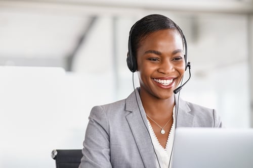 Customer Success representative on phone with client